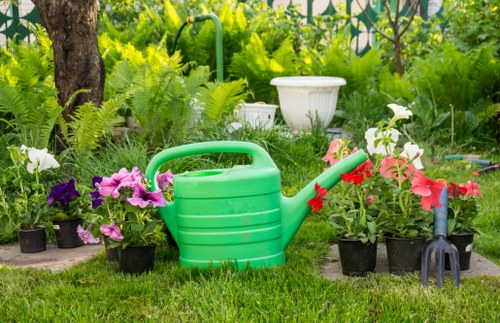 Gardeners sorting green waste into compost and recycling streams