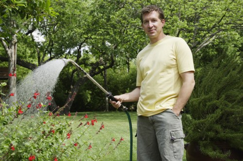 Professional landscaper designing a garden layout in a Mottingham backyard